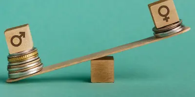 Abbildung des Gender Pay Gap durch eine Schaukel mit Geld und dem männlich und weiblich Zeichen